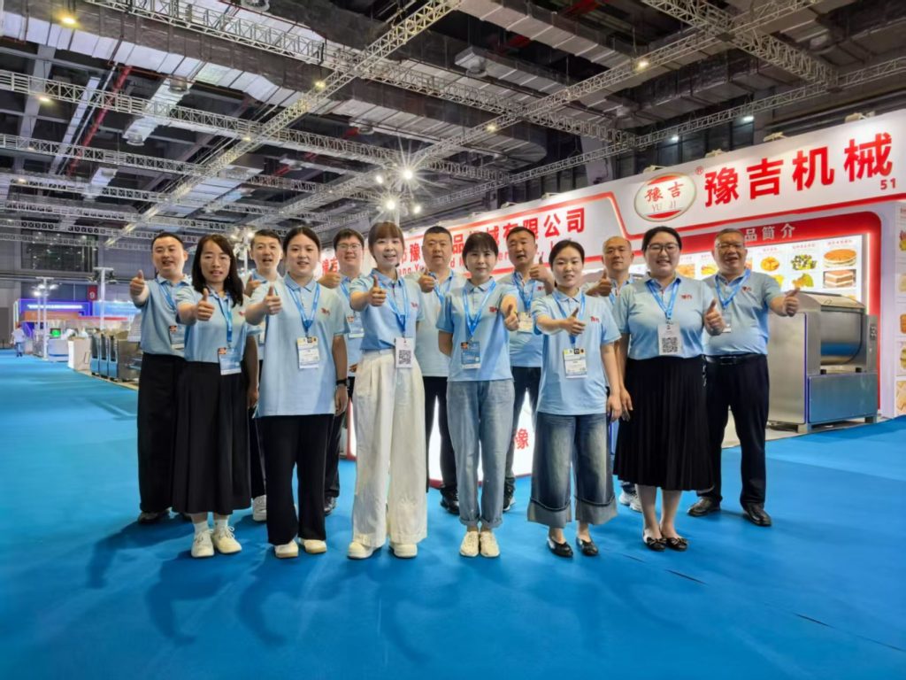 Professional food machinery engineering team after a successful Bakery China exhibition